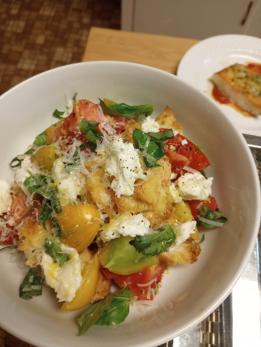 Heirloom tomato and burrata salad with fresh basil and toasted bread